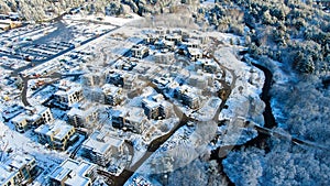 Top view of country houses in winter. Motion. Aerial view forest and detached houses in winter