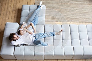 Top view of couple relaxing on sofa