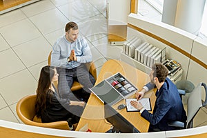 Top view on couple sitting in dealership