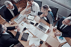 Top view of coworkers in elegant formalwear photo