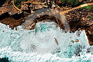 Top view of crashing waves down at the Mahon Pool in Maroubra