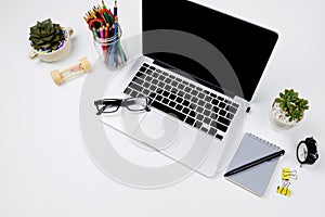 Top view creative flat lay photo of modern workplace with laptop, top view laptop background and copy space on white background,