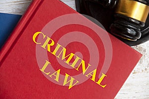 Top view of Criminal law book with gavel on white background. Probate law concept