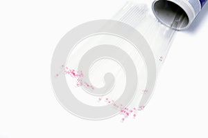 Top view and crop of medical capillary glass tube spread and container on white background.