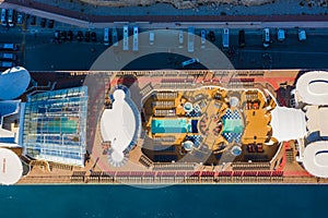 Top view of the cruise ship pool close-up. sunbeds, pool and people relax in sun