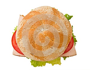 Top view of a crusty turkey kaiser sandwich photo