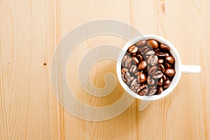 Top view of a cup of coffee beans with space for text