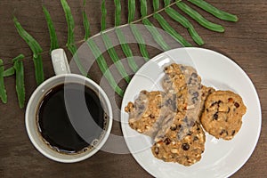 Top view on cup of coffee and  chocolate  chip cookies