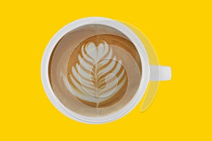 Top view of cup of coffee latte on colour background