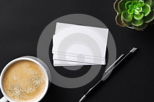 Top view of cup with espresso and white business card template