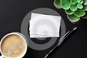 Top view of cup with espresso and white business card template