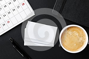 Top view of cup with espresso and white business card template