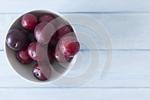 Top view of the Cup with red plums