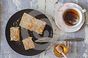 Top view of cup of red tea with honey