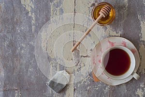 Top view of cup of red tea with honey