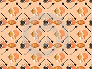 Top view of cups of fresh coffee, croissants and spoons on orange