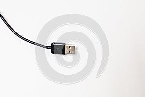 Top view of curved black USB cable isolated on white High resolution photo