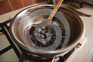 Top view of dark chocolate tablets in a bowl on water bath. Worlds chocolate day