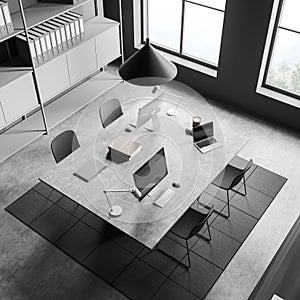 Top view on dark office room interior with two desktops