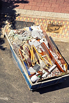 Top view of debris container full of material from a house renovation