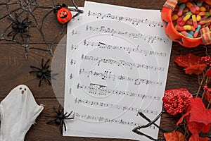 Top view of decorations Happy Halloween Festival and music notes paper background concept.