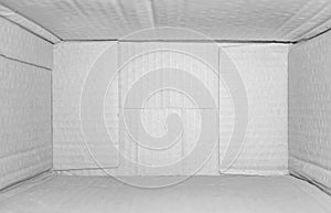 Top view of deep empty cardboard box, opened white paper carton box, empty cardboard box close up, inside view