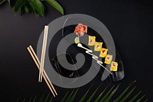 Top view of deep-fried soft-shell crab, cucumber, mango, mayonnaise and tobiko