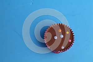 Top view of the delicious peanut butter cup decorated with candies