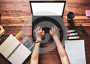 Top view.Designer in Scottish shirt, Graphic creative holding Mouse pen and working on laptop in office,Sunset background,