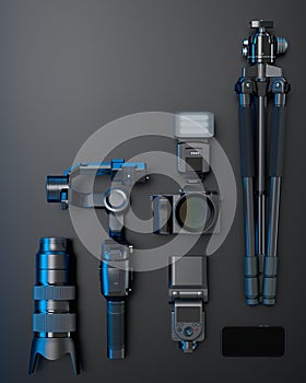 Top view of designer workspace and photography gear on black table background