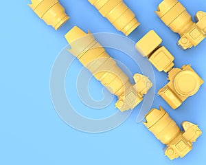 Top view of designer workspace and photography gear on blue table background