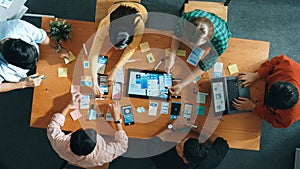 Top view of developer team working together to write idea on board. Convocation.