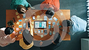 Top view of developer team working together to write idea on board. Convocation.