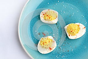 Top view deviled eggs with paprika and salt
