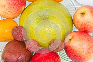 Top view of different fruits in the glass bowl