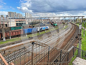 Top view of different railway wagons and tanks on an industrial railroad with rails for the transport of goods and improved modern