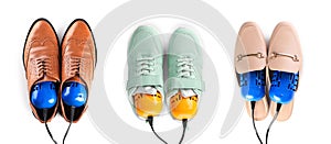 Top view of dIfferent stylish footwear with electric shoe dryers on white background, collage. Banner design