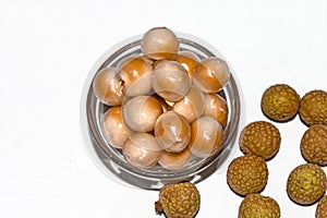 Top view of Dimocarpus longan.A bunch of Longan fruits with green leaves on white isolated background