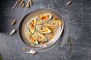 Top view dish with oysters on grey gackground