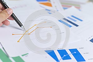 Top view of Documents with analytics data lying on table,selective focus