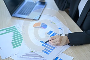 Top view of Documents with analytics data lying on table,selective focus