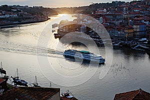 Top view of Douro river and Ribeira at dusk in Porto