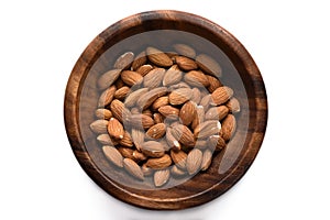 Top view dried almond in wood bowl on white background.