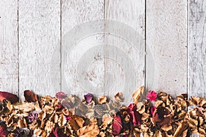 Top view of Dried flowers on wooden table background. Free space for your text.