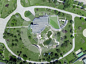 Top view from drone of luxurious country estate with mansion and designer backyard