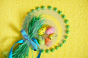 Top view.Easter colored eggs in circle on yellow background. Bright postcard.eggs Easter Frame in circle shape on a yellow