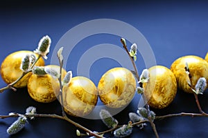 Top view easter composition with willow branch and eggs.