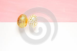 Top view of easter eggs colored with golden paint in differen patterns.