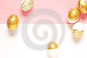 Top view of easter eggs colored with golden paint in differen patterns.