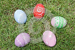 Top view of easter eggs on green grass